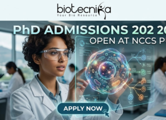 PhD Admissions 2026 Open at NCCS Pune | Life Science Graduates Must Apply Before Deadline! PhD Admissions 2026 Open at NCCS Pune Life Science Graduates Must Apply Before Deadline! A professional and futuristic featured image for PhD Admissions 2026 at NCCS Pune. The image depicts a female researcher in a white lab coat and safety goggles interacting with a vibrant, glowing 3D holographic cell model that displays complex biological pathways. The setting is a modern, high-tech laboratory with other scientists working in the background. The Biotecnika logo is placed at the top center, the main heading reads "PhD ADMISSIONS 2026 OPEN AT NCCS PUNE," and a sleek "APPLY NOW" button with a cursor icon is located at the bottom center.