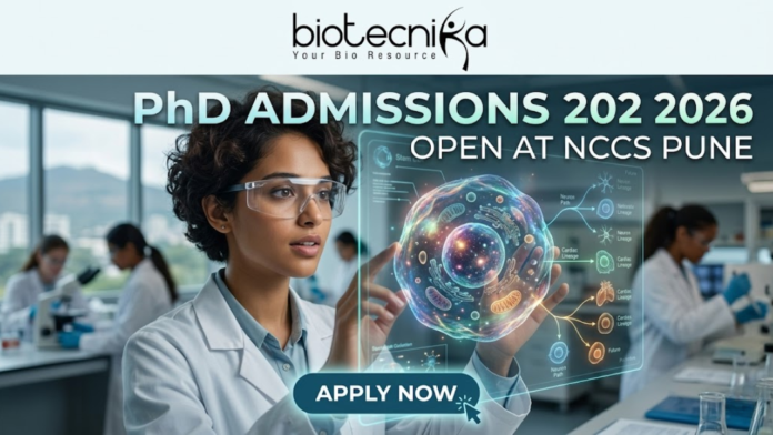 PhD Admissions 2026 Open at NCCS Pune Life Science Graduates Must Apply Before Deadline! PhD Admissions 2026 Open at NCCS Pune Life Science Graduates Must Apply Before Deadline! A professional and futuristic featured image for PhD Admissions 2026 at NCCS Pune. The image depicts a female researcher in a white lab coat and safety goggles interacting with a vibrant, glowing 3D holographic cell model that displays complex biological pathways. The setting is a modern, high-tech laboratory with other scientists working in the background. The Biotecnika logo is placed at the top center, the main heading reads "PhD ADMISSIONS 2026 OPEN AT NCCS PUNE," and a sleek "APPLY NOW" button with a cursor icon is located at the bottom center.