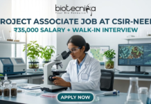 Project Associate Job at CSIR-NEERI | ₹35,000 Salary + Walk-in Interview | Don’t Miss! Project Associate Job at CSIR-NEERI ₹35,000 Salary + Walk-in Interview – Life Science Graduates Don’t Miss! A high-quality featured image for a "Project Associate Job at CSIR-NEERI." The image depicts a female scientist in a white lab coat and safety glasses, meticulously focused as she uses a microscope in a bright, modern environmental laboratory. The lab is filled with scientific equipment, soil samples in glass jars, and healthy green plants, reflecting an environmental research theme. A computer monitor in the background displays biological data and microscopic views of microbes. The Biotecnika logo is at the top, followed by the bold title and a tagline stating "₹35,000 SALARY + WALK-IN INTERVIEW." A prominent teal "APPLY NOW" button is located at the bottom center.
