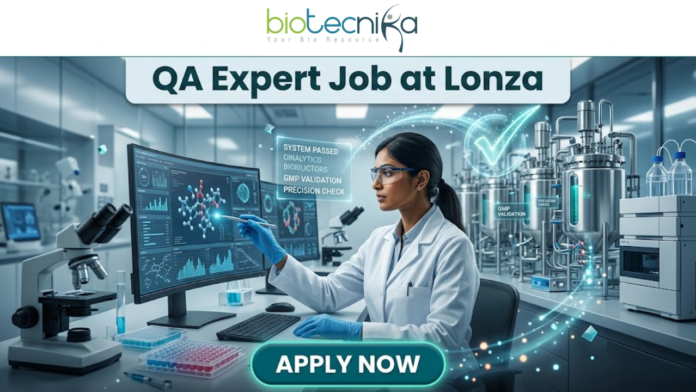 QA Job at Lonza Careers QA Expert Hyderabad Role (1) QA Job at Lonza Careers | QA Expert Hyderabad Role. A professional promotional image for a "QA Expert Job at Lonza" featuring the Biotecnika logo at the top. The scene depicts a female scientist in a white lab coat working in a state-of-the-art biotechnology facility. She is analyzing molecular data on a large computer monitor while a glowing holographic overlay displays a large green checkmark and text such as "GMP VALIDATION" and "SYSTEM PASSED." The background shows modern stainless steel bioreactors and laboratory equipment, emphasizing a high-standard Quality Assurance environment. A prominent teal "APPLY NOW" button is positioned at the bottom center.