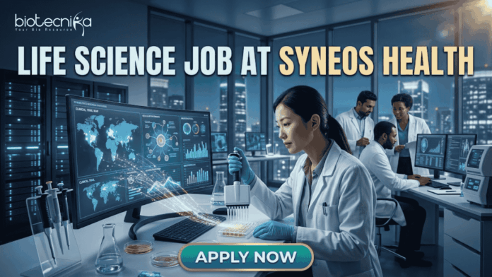 Life Science Job at Syneos Health | Central Monitor Role Life Science Job at Syneos Health | Central Monitor Role. A professional promotional graphic for a "Life Science Job at Syneos Health" featuring the Biotecnika logo at the top. The image depicts a female scientist in a white lab coat and blue gloves using a multichannel pipette on a microplate in a modern, high-tech laboratory. A large computer monitor in the foreground displays complex global data visualizations, including a world map with interconnected nodes, cellular diagrams, and data graphs. In the background, other researchers are seen working at their stations. The laboratory features large glass windows that reveal a glowing city skyline at night. A large, prominent "APPLY NOW" button is centered at the bottom.