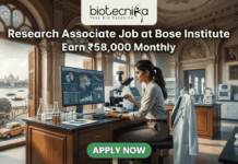 Research Associate Job at Bose Institute – Earn ₹58,000 Monthly in Top Life Science Project! A professional featured image for a job posting titled "Research Associate Job at Bose Institute" with a tagline "Earn ₹58,000 Monthly." The image depicts a female scientist in a white lab coat and glasses working with a microscope and a computer monitor displaying complex molecular structures. The setting is a majestic, classical laboratory with high arched windows and ornate architecture. Visible through the window is a scenic view of Kolkata, featuring a signature yellow taxi and a river with traditional boats. The Biotecnika logo is positioned at the top, and a prominent green "APPLY NOW" button is located at the bottom center.