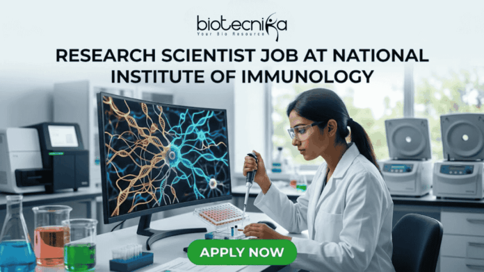 Research Scientist Job at National Institute of Immunology – Cancer Biology Project Hiring Now! Research Scientist Job at National Institute of Immunology – Cancer Biology Project Hiring Now! "A featured image job banner titled 'RESEARCH SCIENTIST JOB AT NATIONAL INSTITUTE OF IMMUNOLOGY' and featuring the biotecnika 'IMMUNOLOG TECH' logo, depicting a focused Indian female scientist in a lab coat using a pipette while a complex, multi-colored 3D map of immune cell pathways is displayed on her curved monitor, with other high-tech lab equipment in the blurred background and a green 'APPLY NOW' button at the bottom."
