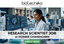 Research Scientist Job at PGIMER Chandigarh | PhD in Life Sciences Candidates Apply Now Research Scientist Job at PGIMER Chandigarh PhD in Life Sciences Candidates Apply Now. A 1280x720 image for a "Research Scientist Job at PGIMER Chandigarh." It features a smiling Indian female scientist in a lab, with the famous "Open Hand Monument" of Chandigarh visible through the window. The Biotecnika logo is at the top, the job title is centered on a white translucent bar, and a green "APPLY NOW" button is at the bottom.