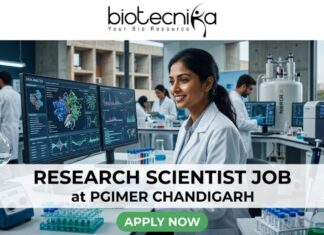 Research Scientist Job at PGIMER Chandigarh | PhD in Life Sciences Candidates Apply Now Research Scientist Job at PGIMER Chandigarh PhD in Life Sciences Candidates Apply Now. A 1280x720 image for a "Research Scientist Job at PGIMER Chandigarh." It features a smiling Indian female scientist in a lab, with the famous "Open Hand Monument" of Chandigarh visible through the window. The Biotecnika logo is at the top, the job title is centered on a white translucent bar, and a green "APPLY NOW" button is at the bottom.