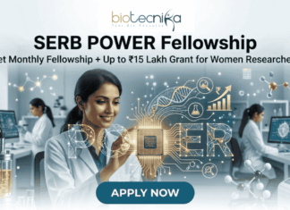 SERB POWER Fellowship – Get Monthly Fellowship + Up to ₹15 Lakh Grant for Women Researchers A promotional featured image for the SERB POWER Fellowship, featuring the Biotecnika logo at the top center. The main headline reads "SERB POWER Fellowship" with the sub-tagline "Get Monthly Fellowship + Up to ₹15 Lakh Grant for Women Researchers." The image depicts a smiling female scientist in a white lab coat interacting with a glowing, futuristic digital interface in a high-tech laboratory. In the center, a holographic circuit chip glows with the word "POWER". The background shows a clean, modern lab setting with other women researchers, advanced lab equipment like a bioreactor, and computer screens displaying molecular data and currency symbols. At the bottom center is a prominent teal "APPLY NOW" button.
