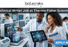 Technical Writer Job at Thermo Fisher Scientific – Life Science Career in Bangalore! Technical Writer Job at Thermo Fisher Scientific – Life Science Career in Bangalore! A professional and realistic featured image for a job posting. Two scientists—a man and a woman—are collaborating in a modern, high-tech laboratory filled with advanced scientific equipment like centrifuges and fluidic systems. They are focused on a digital tablet displaying complex technical data and diagrams. At the top, the Biotecnika logo sits above the bold title "Technical Writer Job at Thermo Fisher Scientific." A vibrant green "APPLY NOW" button is positioned in the bottom right corner.
