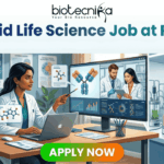 Top Hybrid Life Science Job at Pfizer | Apply Now Before Deadline! Top Hybrid Life Science Job at Pfizer Apply Now Before Deadline! Biotecnika job advertisement illustration for a 'Hybrid Life Science Job at Pfizer,' split into a home office/podcast studio and a biology lab. Text at the top reads, 'Biotecnika Your Bio Resource' and 'Hybrid Life Science Job at Pfizer | Shape the Future of Health | Combine Lab Innovation with Flexibility.' On the left, a woman of color with dark hair at a desk with a laptop points at a monitor displaying molecular structures and a video call with two male scientists. On the right, a woman of color with dark hair works in a lab with glass bioreactors and a microscope, surrounded by molecular models and a 'Pfizer' logo text block. A large green 'APPLY NOW' button is at the bottom center.