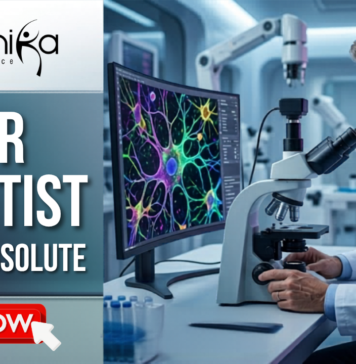 Exclusive Job Opening – Senior Scientist Role for Ph.D, MTech, and MSc Candidates at Absolute | Apply Now Senior Scientist Job at Absolute | PhD, MTech, & MSc Candidates. A professional featured image for a Senior Scientist job opening at Absolute. On the left side, bold white text reads "SENIOR SCIENTIST ROLE AT ABSOLUTE" against a sleek grey backdrop. The top center features the Biotecnika logo. On the right, a realistic scene shows an experienced male scientist in a white lab coat using a microscope in a high-tech laboratory, with a large monitor displaying vibrant, colorful neural cell structures. A prominent green "APPLY NOW" button is located at the bottom center.