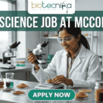 Urgent Food Science Job at McCormick – QA Executive Hiring in Sonipat! Urgent Food Science Job at McCormick – QA Executive Hiring in Sonipat! A high-quality promotional featured image for a "Food Science Job at McCormick." The graphic features a female scientist of Indian ethnicity in a professional white lab coat and safety goggles, meticulously using a pipette to test a sample in a petri dish. The laboratory setting is bright and modern, with the foreground showcasing several glass jars filled with vibrant, colorful spices like turmeric, paprika, and dried herbs, reflecting the McCormick brand's focus. The top of the image displays the Biotecnika logo, while a large, bold heading reads "FOOD SCIENCE JOB AT MCCORMICK" across the top. At the bottom center, there is a prominent, rounded teal "APPLY NOW" button.