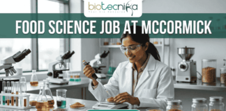 Urgent Food Science Job at McCormick – QA Executive Hiring in Sonipat! Urgent Food Science Job at McCormick – QA Executive Hiring in Sonipat! A high-quality promotional featured image for a "Food Science Job at McCormick." The graphic features a female scientist of Indian ethnicity in a professional white lab coat and safety goggles, meticulously using a pipette to test a sample in a petri dish. The laboratory setting is bright and modern, with the foreground showcasing several glass jars filled with vibrant, colorful spices like turmeric, paprika, and dried herbs, reflecting the McCormick brand's focus. The top of the image displays the Biotecnika logo, while a large, bold heading reads "FOOD SCIENCE JOB AT MCCORMICK" across the top. At the bottom center, there is a prominent, rounded teal "APPLY NOW" button.