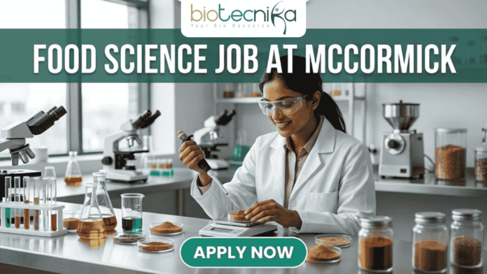 Urgent Food Science Job at McCormick – QA Executive Hiring in Sonipat! Urgent Food Science Job at McCormick – QA Executive Hiring in Sonipat! A high-quality promotional featured image for a "Food Science Job at McCormick." The graphic features a female scientist of Indian ethnicity in a professional white lab coat and safety goggles, meticulously using a pipette to test a sample in a petri dish. The laboratory setting is bright and modern, with the foreground showcasing several glass jars filled with vibrant, colorful spices like turmeric, paprika, and dried herbs, reflecting the McCormick brand's focus. The top of the image displays the Biotecnika logo, while a large, bold heading reads "FOOD SCIENCE JOB AT MCCORMICK" across the top. At the bottom center, there is a prominent, rounded teal "APPLY NOW" button.