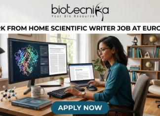 Work From Home Scientific Writer Job at Eurofins | Life Science Graduates Don’t Miss This! Work From Home Scientific Writer Job at Eurofins. A high-quality, realistic featured image for a "Work From Home Scientific Writer Job at Eurofins." The scene depicts a professional woman in a bright, modern home office, focused on her dual-monitor setup. One screen shows a detailed 3D protein structure, while the other displays a scientific manuscript. Her desk is neatly organized with a laptop, a mechanical keyboard, a "scientific" coffee mug, and molecular models. A cozy home atmosphere is suggested by a cat sitting on the windowsill in the background. The Biotecnika logo is featured at the top center, the job title is in bold black text, and a teal "APPLY NOW" button is centered at the bottom.