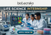 life science internship at Federation of Asian Biotech Associations (FABA). A high-resolution, professional featured image for a "Life Science Internship at Federation of Asian Biotech Associations." The scene features three young, enthusiastic interns (two women and one man) in white lab coats and safety goggles, collaborating in a cutting-edge laboratory. They are pointing at a computer monitor displaying vibrant 3D protein structures and heatmaps. The background shows a modern city skyline at dusk through large windows, alongside advanced lab equipment like PCR machines. The Biotecnika logo is placed at the top center, the main title is in bold gold and white text, and a sleek "APPLY NOW" button with a handshake icon is at the bottom.