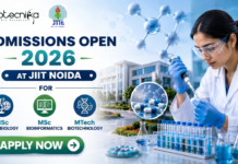 Admissions Open 2026 at JIIT Noida for MSc Microbiology, Bioinformatics & MTech Biotechnology Admissions Open 2026 at JIIT Noida for MSc Microbiology, Bioinformatics & MTech Biotechnology. Featured banner for “Admissions Open 2026 at JIIT Noida” featuring the Biotecnika and JIIT logos at the top, a scientist performing drug research in a modern laboratory, molecular and pharmaceutical-themed graphics, a university campus backdrop, program highlights for MSc Microbiology, MSc Bioinformatics, and MTech Biotechnology, and a bold “Apply Now” button at the bottom.