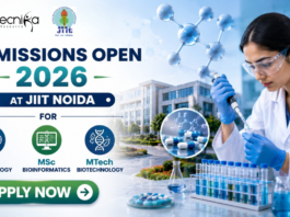 Admissions Open 2026 at JIIT Noida for MSc Microbiology, Bioinformatics & MTech Biotechnology. Featured banner for “Admissions Open 2026 at JIIT Noida” featuring the Biotecnika and JIIT logos at the top, a scientist performing drug research in a modern laboratory, molecular and pharmaceutical-themed graphics, a university campus backdrop, program highlights for MSc Microbiology, MSc Bioinformatics, and MTech Biotechnology, and a bold “Apply Now” button at the bottom.