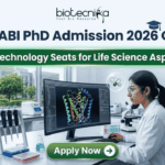 BRIC-NABI PhD Admission 2026 Out Now – 36 Biotechnology Seats! BRIC-NABI PhD Admission 2026 Out Now – 36 Biotechnology Seats for Life Science Aspirants!. A high-resolution corporate featured image for BRIC-NABI PhD Admission 2026. The top center features the Biotecnika logo above the bold text: "BRIC-NABI PhD Admission 2026 Out Now." Below this, a glowing green banner highlights "36 Biotechnology Seats for Life Science Aspirants!" The background shows a modern, bright laboratory setting where a female scientist is focused on a large curved monitor displaying a colorful 3D protein molecular structure. Lab equipment, including pipettes and a microscope, is visible on the clean white workstation. At the bottom center, there is a prominent green "Apply Now" button with a right-arrow icon.