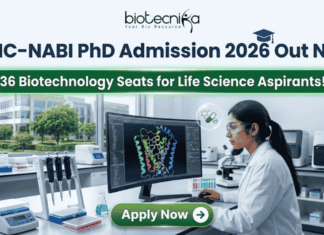 BRIC-NABI PhD Admission 2026 Out Now – 36 Biotechnology Seats! BRIC-NABI PhD Admission 2026 Out Now – 36 Biotechnology Seats for Life Science Aspirants!. A high-resolution corporate featured image for BRIC-NABI PhD Admission 2026. The top center features the Biotecnika logo above the bold text: "BRIC-NABI PhD Admission 2026 Out Now." Below this, a glowing green banner highlights "36 Biotechnology Seats for Life Science Aspirants!" The background shows a modern, bright laboratory setting where a female scientist is focused on a large curved monitor displaying a colorful 3D protein molecular structure. Lab equipment, including pipettes and a microscope, is visible on the clean white workstation. At the bottom center, there is a prominent green "Apply Now" button with a right-arrow icon.