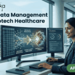 Clinical Data Management Job at Biotech Healthcare | Apply Online Here Clinical Data Management Job at Biotech Healthcare Apply Online Here. A corporate job advertisement for a "Clinical Data Management Job at Biotech Healthcare," featuring a professional female of South Asian descent smiling and working at a desk with dual monitors. The screens display data visualizations of molecular structures and CDM progress dashboards with text labels like "CDM QUERY RESOLUTION" and "VALIDATED DATA STREAM." Through the large office window behind her, a modern building labeled "HOSPITAL" and "CLINICAL RESEARCH CENTRE" is visible. The Biotecnika logo is at the top left, and a prominent green "APPLY NOW" button with an arrow icon is at the bottom right. Other colleagues are working blurred in the background.