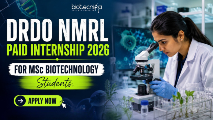 DRDO NMRL Paid Internship 2026 For MSc Biotechnology Students DRDO NMRL Paid Internship 2026 For MSc Biotechnology Students. Featured image showing a realistic biotechnology laboratory scene with a young female scientist using a microscope in a modern research lab. Bold text highlights “DRDO NMRL Paid Internship 2026 For MSc Biotechnology Students” with a bright neon-green and blue theme. The Biotecnika logo appears at the top center, while a large “Apply Now” button is placed prominently at the bottom. The design is vibrant, professional, and attention-grabbing, featuring biotech visuals such as DNA strands, lab equipment, and research elements to appeal to MSc Biotechnology students.