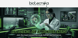 Exciting Life Science Job at Monster Energy | Don’t Miss This Opportunity Exciting Life Science Job at Monster Energy Don't Miss This. A job advertisement image with the header logo "biotecnika Your Bio Resource" and a stylized figure. The central scene is a detailed, futuristic laboratory with green lighting, where a female scientist in a lab coat interacts with a glowing hologram of an ATP molecule and "Human Performance Cell." Background monitors display biometric data and a separate room shows gamers and a person on a treadmill, symbolizing human performance research. Large bold text across the middle reads "LIFE SCIENCE JOB AT MONSTER ENERGY", followed by the subtext, "Join the team powering peak human performance." A prominent green "APPLY NOW" button is at the bottom center.