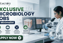 Exclusive Microbiology Jobs at Minimalist | Apply For Quality Assurance Executive Role Exclusive Microbiology Jobs at Minimalist Apply For Quality Assurance Executive Role. A professional corporate recruitment banner for "EXCLUSIVE MICROBIOLOGY JOBS @ Minimalist" featuring the Biotecnika logo. The image showcases a focused female scientist in a white lab coat and blue gloves working in a high-tech laboratory. The theme is centered on skincare science, with laboratory monitors displaying "Skin Microbiome Analysis" and "Probiotic Effectiveness." Shelves in the background hold various skincare bottles and jars. Hexagonal graphics highlight scientific visualizations of skin cells and probiotic serums. Four circular icons at the bottom represent research, aquatic sciences, innovation, and skincare product formulation. A prominent green "APPLY NOW" button is positioned at the bottom left.