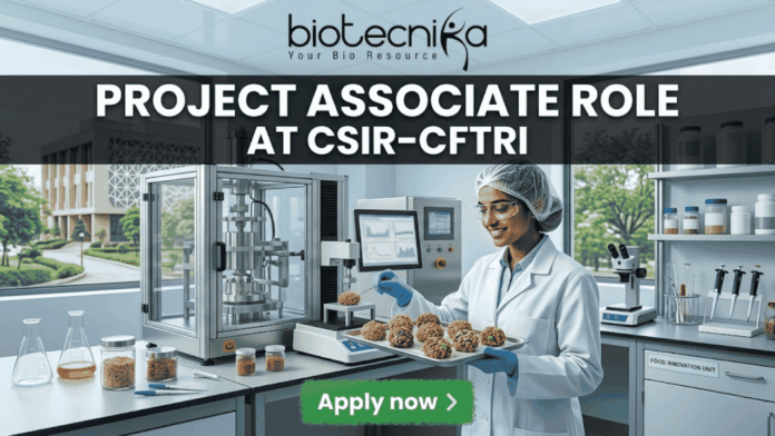 Project Associate Role at CSIR-CFTRI Project Associate Role at CSIR-CFTRI. A realistic, wide featured image of a dynamic food technology lab at a prestigious research campus. A young female scientist meticulously works on advanced machinery and nutrient-dense food prototypes. Bold white text at the top states "PROJECT ASSOCIATE ROLE" followed by "AT CSIR-CFTRI". The full biotecnika logo is also at the top center, and a green button at the bottom reads "Apply now".