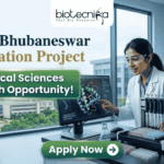 NISER Bhubaneswar Dissertation Project | Biological Sciences Research Opportunity! Corporate-style recruitment banner for NISER Bhubaneswar Dissertation Project. The image features a female scientist in a lab coat interacting with a protein structure on a monitor. Text includes "Biological Sciences Research Opportunity!" and the Biotecnika logo, with a green "Apply Now" button at the bottom.