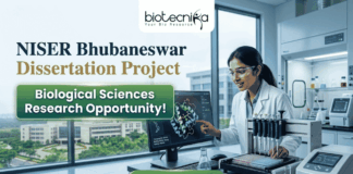 NISER Bhubaneswar Dissertation Project | Biological Sciences Research Opportunity! Corporate-style recruitment banner for NISER Bhubaneswar Dissertation Project. The image features a female scientist in a lab coat interacting with a protein structure on a monitor. Text includes "Biological Sciences Research Opportunity!" and the Biotecnika logo, with a green "Apply Now" button at the bottom.