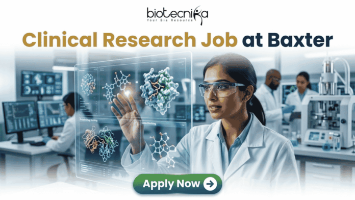 Latest Clinical Research Job at Baxter | Apply Now Latest Clinical Research Job at Baxter | Apply Now. A featured job advertisement banner for biotecnika, titled "Clinical Research Job at Baxter," set in a modern, futuristic laboratory. The visual focuses on a diverse female scientist, of South Asian or Indian descent, with safety glasses and a lab coat, who is interacting with and gesturing towards a floating, transparent holographic screen. The screen displays complex 3D molecular models of a protein and a drug, along with labels like 'Protein Drug Docking' and 'Data Docking'. In the blurred background, other researchers work with equipment and computer monitors in a well-equipped facility. At the top center is the "biotecnika Your Bio Resource" logo. At the bottom center, a prominent green button contains the text 'Apply Now' with a white arrow icon.
