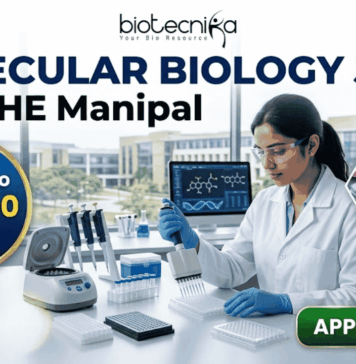 ₹61,000 Salary Molecular Biology Job at MAHE Manipal | Apply Now! ₹61,000 Salary Molecular Biology Job at MAHE Manipal | Apply. A professional recruitment banner from Biotecnika for a "Molecular Biology Job at MAHE Manipal." The image features a female scientist in a lab coat and safety glasses, meticulously using a multichannel pipette at a well-equipped laboratory bench. The banner prominently highlights the text "Earn Upto ₹61,000 Salary." and includes other text elements like "biotecnika" and "MOLECULAR BIOLOGY JOB at MAHE Manipal." In the background, other lab instruments, computer monitors displaying biological data, and a modern university campus through the windows are visible. Icons for a pipette, a DNA helix, and a multiwell plate, along with hexagonal frames showing biological research images, represent the drug research theme. A large, green, glowing "APPLY NOW" button is in the bottom right corner.