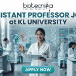 Assistant Professor Jobs at KL University | Food Technology Jobs for PhD Graduates A professional recruitment banner for Assistant Professor jobs at KL University's Food Technology Department. The image features two scientists in a modern laboratory working with bioreactors and 3D food printing technology. It includes the Biotecnika logo at the top and a prominent orange "Apply Now" button at the bottom.