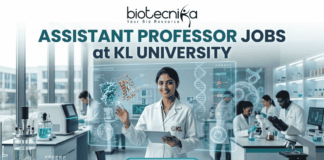 Assistant Professor Jobs at KL University | Food Technology Jobs for PhD Graduates A professional recruitment banner for Assistant Professor jobs at KL University's Food Technology Department. The image features two scientists in a modern laboratory working with bioreactors and 3D food printing technology. It includes the Biotecnika logo at the top and a prominent orange "Apply Now" button at the bottom.