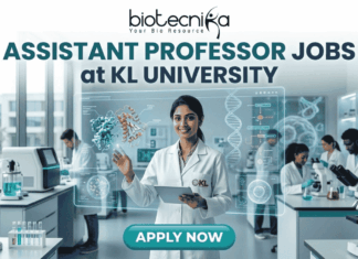 Assistant Professor Jobs at KL University | Food Technology Jobs for PhD Graduates A professional recruitment banner for Assistant Professor jobs at KL University's Food Technology Department. The image features two scientists in a modern laboratory working with bioreactors and 3D food printing technology. It includes the Biotecnika logo at the top and a prominent orange "Apply Now" button at the bottom.