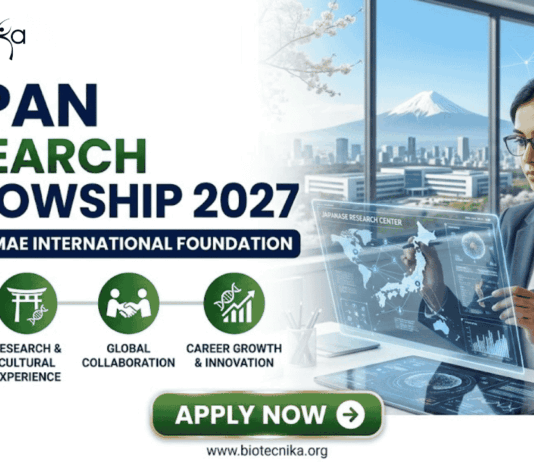 A professional promotional graphic from Biotecnika advertising the "Japan Research Fellowship 2027" at the "Matsumae International Foundation." The left side highlights four key benefits: full funding and allowance, research and cultural experience, global collaboration, and career growth and innovation. The right side shows a woman in a business suit interacting with a futuristic holographic display featuring a map of Japan and data charts. The background features office windows with a scenic view including a distant Mount Fuji and a cityscape with cherry blossom branches. At the bottom, a green "APPLY NOW" button and the website URL "www.biotecnika.org" are clearly visible.
