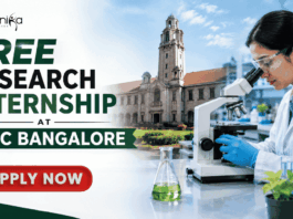 Free Research Internship at IISC Bangalore Golden Opportunity You Can't Miss!! Featured banner for “Free Research Internship at IISC Bangalore” featuring the Biotecnika logo at the top, a researcher using a microscope in a modern laboratory, an academic campus backdrop, research and innovation-themed highlights, and a bold “Apply Now” button at the bottom.