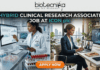 Hybrid Clinical Research Associate Job at ICON plc Apply Now. A job advertisement banner with the top text "biotecnika - Your Bio Resource" and main headline "HYBRID CLINICAL RESEARCH ASSOCIATE JOB AT ICON plc". The image uses a split-screen composition to visualize the hybrid role. The left side depicts a female Clinical Research Associate (CRA) in a lab coat in a modern research lab, analyzing data on a desktop monitor next to a microscope and a rack of marked "GLOBAL TRIALS" blood vials. The right side shows the same professional in business attire in a stylish home office with a city view, seated at a desk on a video conference call on her laptop. An orange "APPLY NOW" button is at the bottom center.