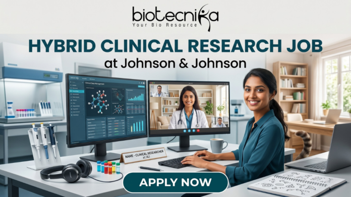 Hybrid Clinical Research Job at Johnson & Johnson Apply Now Hybrid Clinical Research Job at Johnson & Johnson Apply Now. A marketing banner promoting a "HYBRID CLINICAL RESEARCH JOB at Johnson & Johnson", featuring the Biotecnika logo. The central image shows a woman working at a desk, split between a laboratory environment (pipettes, vials) on the left and a home office (bookshelves, cat) on the right. She has dual monitors: one displaying research data, another showing a video conference call. Text on her desk nameplate says, "NAME - CLINICAL RESEARCHER at J&J". A large call-to-action button at the bottom reads "APPLY NOW".