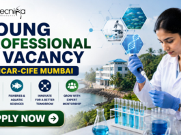ICAR-CIFE Recruitment 2026 Out Now – Young Professional Vacancy for Life Science Graduates in Mumbai! ICAR Recruitment 2026 Out Now – Young Professional Vacancy. Featured banner for “Young Professional Vacancy at ICAR-CIFE Mumbai” featuring the Biotecnika logo at the top, a young researcher conducting laboratory work with test tubes and a microscope, aquatic science and biotechnology-themed graphics, a coastal research institute backdrop, and a bold “Apply Now” button.