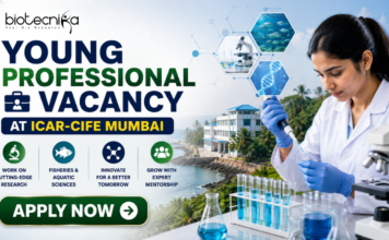 ICAR-CIFE Recruitment 2026 Out Now – Young Professional Vacancy for Life Science Graduates in Mumbai! ICAR Recruitment 2026 Out Now – Young Professional Vacancy. Featured banner for “Young Professional Vacancy at ICAR-CIFE Mumbai” featuring the Biotecnika logo at the top, a young researcher conducting laboratory work with test tubes and a microscope, aquatic science and biotechnology-themed graphics, a coastal research institute backdrop, and a bold “Apply Now” button.