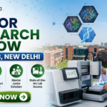 ICGEB New Delhi Hiring Senior Research Fellow | Work in Plant Molecular Biology Research ICGEB New Delhi Hiring Senior Research Fellow Work in Plant Molecular Biology Research. A professional recruitment banner for a "Senior Research Fellow at ICGEB, New Delhi," featuring the Biotecnika logo at the top left. On the right side, a female scientist in a white lab coat operates advanced automated laboratory equipment, with floating hexagonal graphics of protein structures and a DNA helix above her. The background displays a realistic, sunlit view of a modern research institute campus. The left side features the bold headline and four circular icons representing key roles: Lead Advanced Research Projects, Publish High-Impact Findings, Mentor Junior Scholars, and State-of-the-Art Lab Access. A prominent green "Apply Now" button with a white arrow is located at the bottom left.