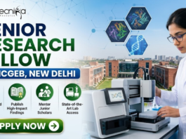 ICGEB New Delhi Hiring Senior Research Fellow | Work in Plant Molecular Biology Research ICGEB New Delhi Hiring Senior Research Fellow Work in Plant Molecular Biology Research. A professional recruitment banner for a "Senior Research Fellow at ICGEB, New Delhi," featuring the Biotecnika logo at the top left. On the right side, a female scientist in a white lab coat operates advanced automated laboratory equipment, with floating hexagonal graphics of protein structures and a DNA helix above her. The background displays a realistic, sunlit view of a modern research institute campus. The left side features the bold headline and four circular icons representing key roles: Lead Advanced Research Projects, Publish High-Impact Findings, Mentor Junior Scholars, and State-of-the-Art Lab Access. A prominent green "Apply Now" button with a white arrow is located at the bottom left.