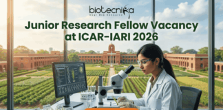 Junior Research Fellow Vacancy at ICAR-IARI 2026 | MSc Life Science Candidates Apply Fast! Junior Research Fellow Vacancy at ICAR-IARI 2026 Apply Fast. A promotional image for a "Junior Research Fellow Vacancy at ICAR-IARI 2026," featuring a female scientist in a modern lab with plant samples and a view of the IARI campus. The "biotecnika" logo is at the top, and a large "APPLY NOW" button is at the bottom.