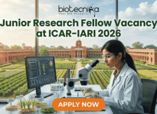 Junior Research Fellow Vacancy at ICAR-IARI 2026 Apply Fast. A promotional image for a "Junior Research Fellow Vacancy at ICAR-IARI 2026," featuring a female scientist in a modern lab with plant samples and a view of the IARI campus. The "biotecnika" logo is at the top, and a large "APPLY NOW" button is at the bottom.