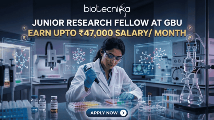 Junior Research Fellow at GBU Earn Upto ₹47,000 Salary Month Junior Research Fellow at GBU Earn Upto ₹47,000 Salary Month. A job advertisement featuring a female researcher in a modern drug research lab, using a multi-channel pipette, surrounded by transparent screens displaying 3D molecular structures. Prominent text at the top reads: "JUNIOR RESEARCH FELLOW AT GBU", followed by a central banner stating: "EARN UPTO ₹47,000 SALARY/ MONTH". The biotecnika logo is at the very top, and a blue button at the bottom says: "APPLY NOW".