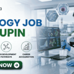 Latest Biology Job At Lupin | BSc Candidates Apply Before It’s Gone! Latest Biology Job At Lupin BSc Candidates Apply Before It's Gone! A detailed, professional recruitment banner for a "BIOLOGY JOB AT LUPIN" by biotecnika Your Bio Resource. The banner features a focused female Indian scientist in a lab coat and safety glasses, using a multichannel pipette to fill a microplate in a modern laboratory. Overlaid on the background, which includes a campus view and scientific monitors with bio-prospecting data and molecular models, are hexagonal panels displaying a DNA helix, a cell structure, and a plant sample. Three key career benefits are listed with icons in green circles: "CUTTING-EDGE DRUG RESEARCH", "DRUG DEVELOPMENT PATHWAYS", and "CAREER ACCELERATION". A prominent green "APPLY NOW" button with a white right arrow is at the bottom center. The company logo is at the top left, and the job title text is prominent on the left.