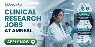 Latest Clinical Research Jobs at Amneal | Apply Before It Closes! Latest Clinical Research Jobs at Amneal Apply Before It Closes! A professional corporate recruitment banner for "CLINICAL RESEARCH JOBS AT AMNEAL" featuring the Biotecnika logo. The image showcases a focused female scientist of Indian heritage in a white lab coat and safety goggles, interacting with a high-tech digital monitor displaying clinical trial data and ECG waveforms. To the right, hexagonal icons highlight key clinical research themes: "Continuous Patient Monitoring," "Multi-modal Data Integration," and "Accelerated Study Timelines." The background depicts a modern, brightly lit clinical facility with other researchers at work. A prominent green "APPLY NOW" button with a white arrow is positioned at the bottom left.
