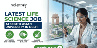 Latest Life Science Job at South Asian University in Delhi | Apply Now Latest Life Science Job at South Asian University in Delhi Apply Now. A professional recruitment banner for the "Latest Life Science Job at South Asian University in Delhi," featuring the Biotecnika logo at the top left. On the right, a female scientist in a white lab coat and safety glasses is shown using a multichannel pipette on a microplate in a modern laboratory setting. The background through a large window offers a clear, realistic view of the India Gate in Delhi, symbolizing the job location. The left side features the bold headline "LATEST LIFE SCIENCE JOB AT SOUTH ASIAN UNIVERSITY IN DELHI" and three green circular icons representing: Advanced Bio-sciences, Global Impact & Reach, and Career Growth Path. A prominent green "apply now" button with a white arrow and the website "biotecnika.org" are located at the bottom.