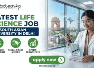 Latest Life Science Job at South Asian University in Delhi | Apply Now Latest Life Science Job at South Asian University in Delhi Apply Now. A professional recruitment banner for the "Latest Life Science Job at South Asian University in Delhi," featuring the Biotecnika logo at the top left. On the right, a female scientist in a white lab coat and safety glasses is shown using a multichannel pipette on a microplate in a modern laboratory setting. The background through a large window offers a clear, realistic view of the India Gate in Delhi, symbolizing the job location. The left side features the bold headline "LATEST LIFE SCIENCE JOB AT SOUTH ASIAN UNIVERSITY IN DELHI" and three green circular icons representing: Advanced Bio-sciences, Global Impact & Reach, and Career Growth Path. A prominent green "apply now" button with a white arrow and the website "biotecnika.org" are located at the bottom.