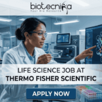 Latest Life Science Job at Thermo Fisher Scientific | Apply Online Here Latest Life Science Job at Thermo Fisher Scientific Apply Online Here. An advertisement for a Life Science Job at Thermo Fisher Scientific, featuring a female scientist in a laboratory pointing to a monitor displaying a molecular model of a protein-drug interaction. Text in the center reads: "LIFE SCIENCE JOB AT THERMO FISHER SCIENTIFIC". A blue button at the bottom says "APPLY NOW". The Biotecnika logo with the tagline "Your Bio Resource" is at the top. Microplates and other lab equipment are visible around her.
